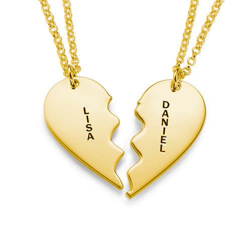 sterling silver couple necklace featuring heart-shaped pendants with names Lisa and Daniel engraved on them.